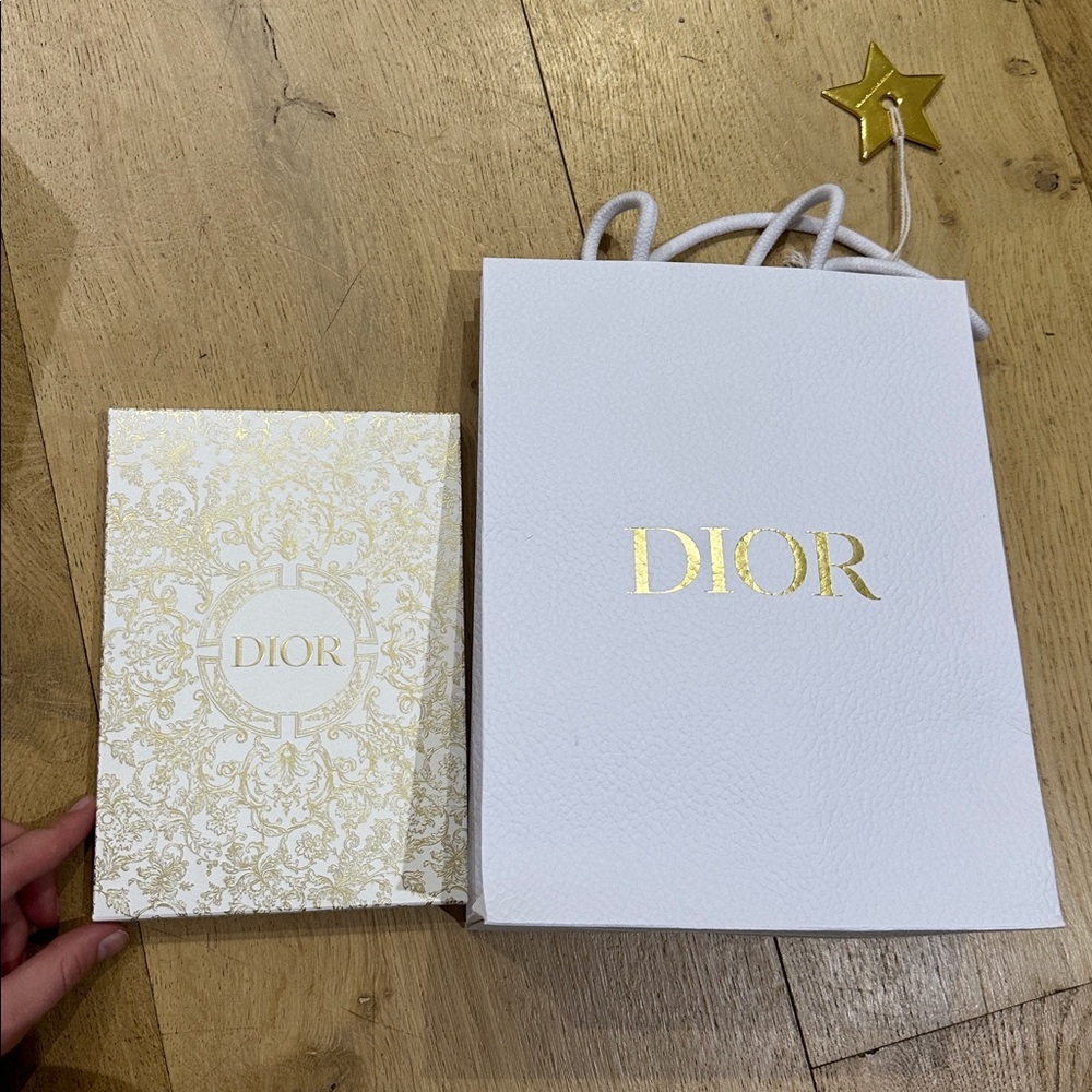 Authentic Dior shopping bag, Dior ribbon, and Dior notebook.